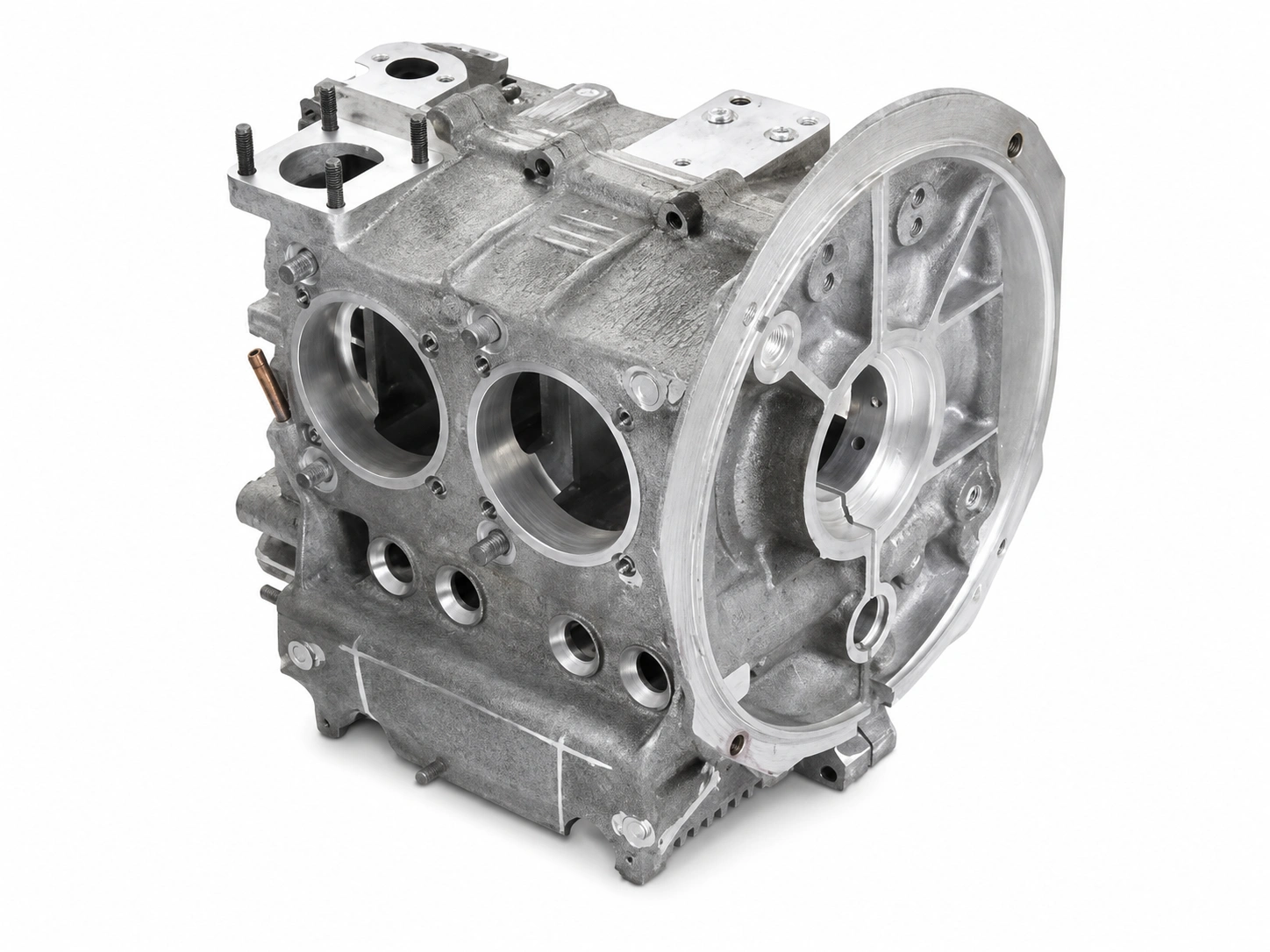 OEM magnesium engine case with machined cylinder bores, mounting surfaces, and reinforced automotive housing features on a white background.